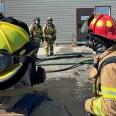 The crew discusses their next training scenario.